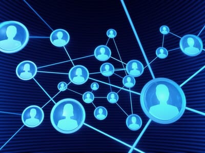 Glowing blue network of connected user profile icons on dark background