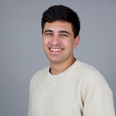 Edwin Dorsey, founder of The Bear Cave newsletter, smiling headshot on gray background