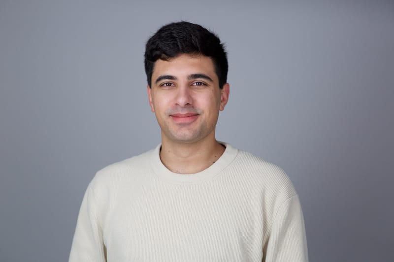 Edwin Dorsey, investigative financial journalist, facing the camera with a slight smile on a gray studio background